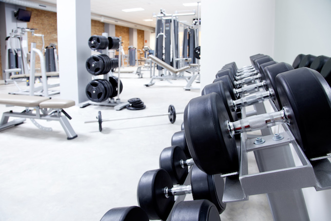 Gym Machines Vs Free Weights: The Ultimate Showdown - Caliber Fitness